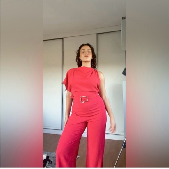 ASYMMETRIC CREPE BUCKLE JUMPSUIT
RED / CORAL . SIZE M, L - Picture 8 of 16